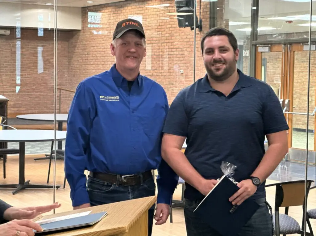 Instructor presents award to student completing Manufacturing Training at Pitt-Titusville MAC Program